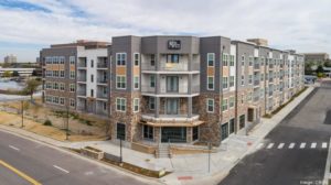 At this luxury apartment community, residents can order poolside delivery from an on-site restaurant that was also included in the recent sale. PROVIDED BY CBRE